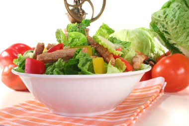 Mixed salad with strips of turkey clipart