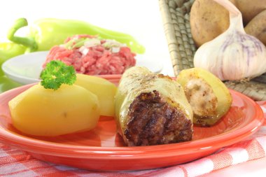 Stuffed peppers with potatoes and fresh parsley clipart