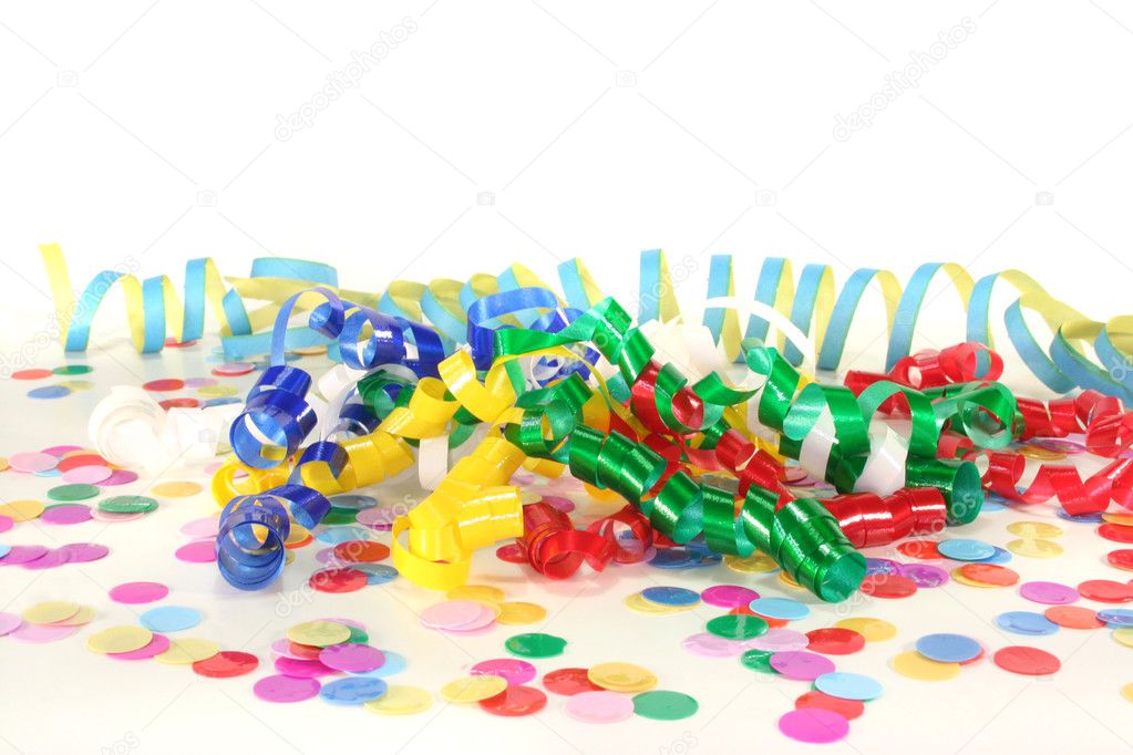 Colorful confetti and streamers on a white background