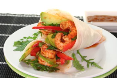 Asian Wrap with king prawns, avocado, red peppers and arugula clipart