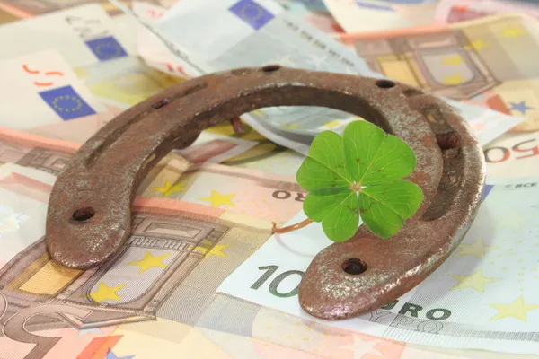 Horseshoe with clover and Euro — Stock Photo, Image