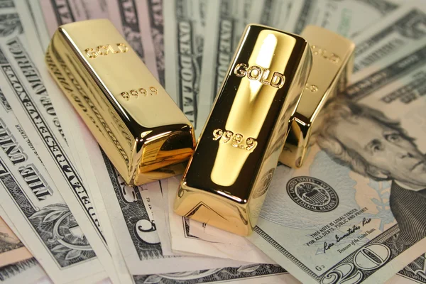 Three Large Gold Bars Many Dollar Bills — Stock Photo, Image