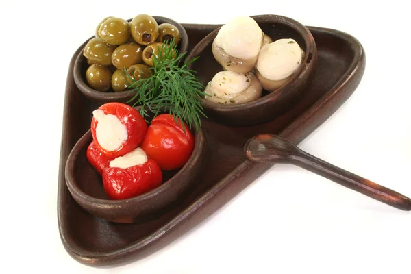 Olives, stuffed peppers and mushrooms — Stock Photo, Image