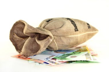 Euro notes and money bag in front of white background clipart