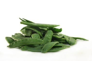 Fresh sugar peas on a white background clipart