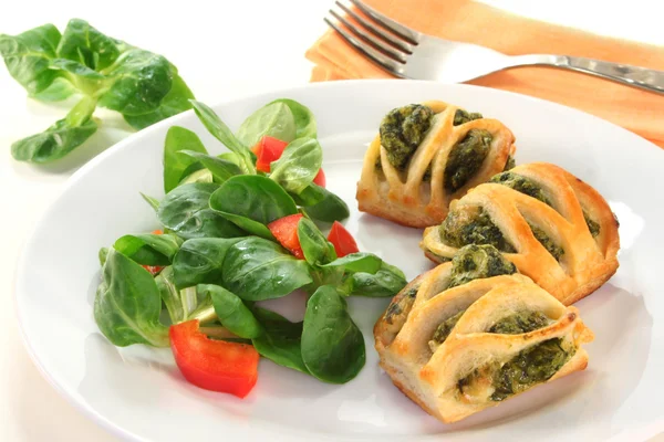 stock image Puff pastry with a spinach-cheese filling and corn salad