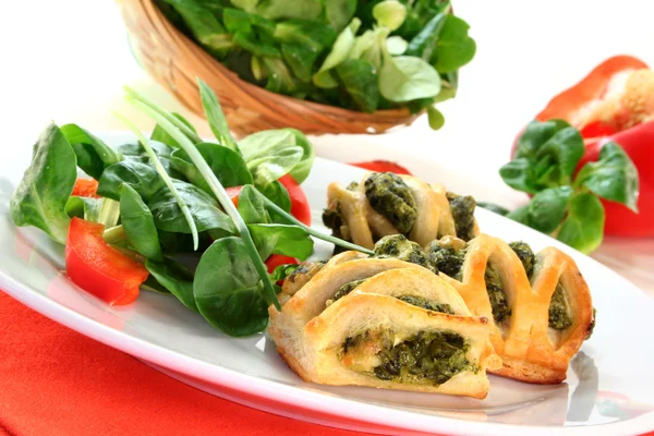 stock image Puff pastry with a spinach-cheese filling and corn salad