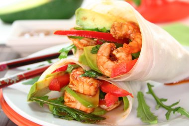 Wrap with shrimp, avocado and arugula clipart