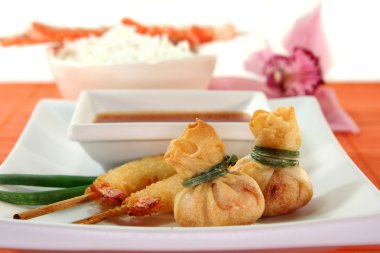 Various Thai specialties with a chilli dip clipart