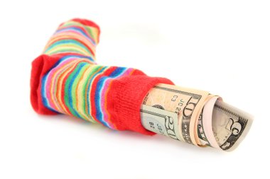 A colorful stockings, stuffed with dollar bills clipart