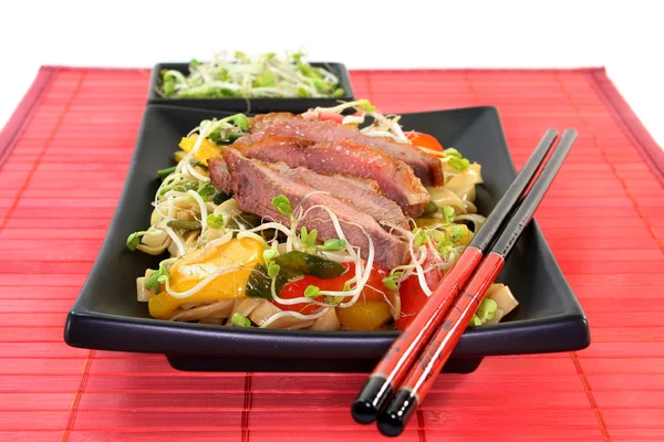 Duck breast with fried noodles — Stock Photo, Image