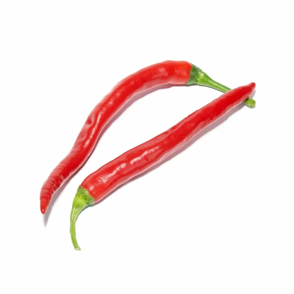 Two red hot chili peppers — Stock Photo, Image