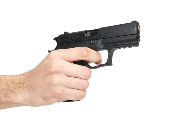 Zwarte pistool in een hand — Stockfoto