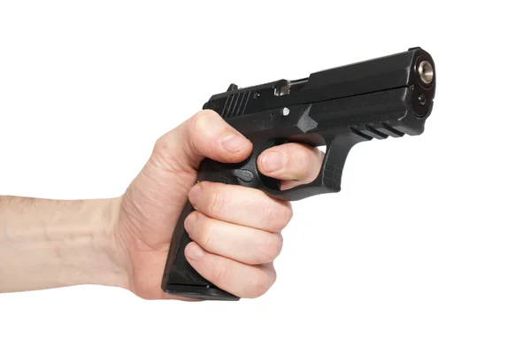 Pistola preta em uma mão — Fotografia de Stock