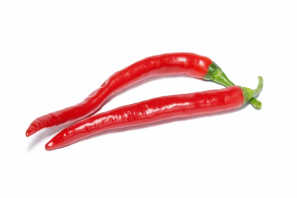 Dvě červené pálivé chilli papričky — Stock fotografie