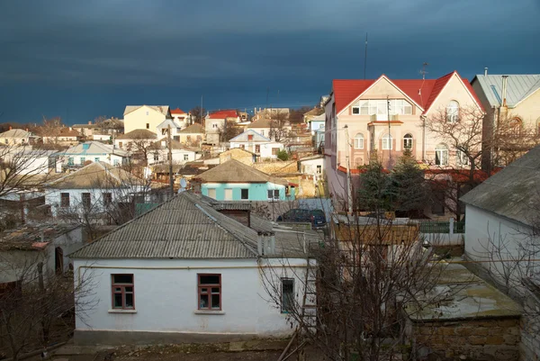 stock image Rural houses with storm clouds.