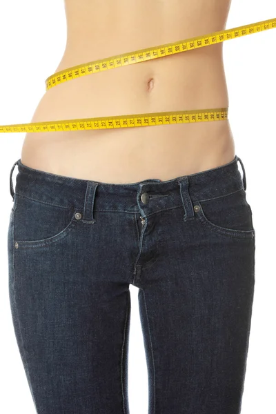 Woman measuring her waist — Stock Photo, Image