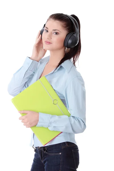 Happy student girl listening to the music — Stock Photo, Image