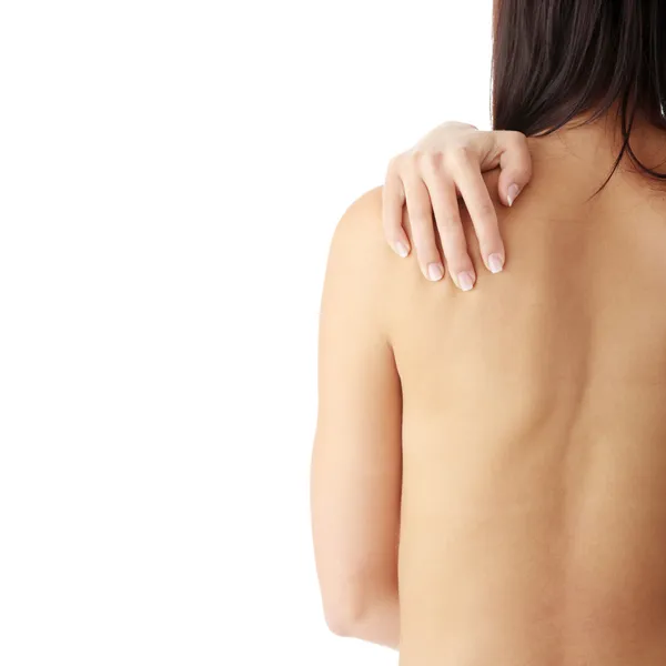 後ろから裸の女性 背中の痛みの概念 分離されました — Stockfoto