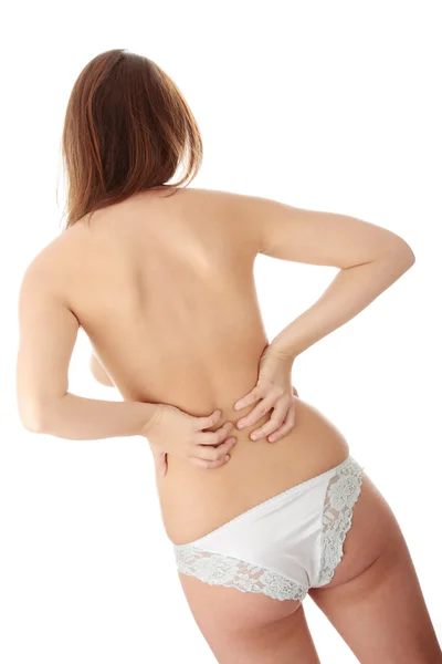 后面的裸体女人 背部疼痛的概念 — 图库照片