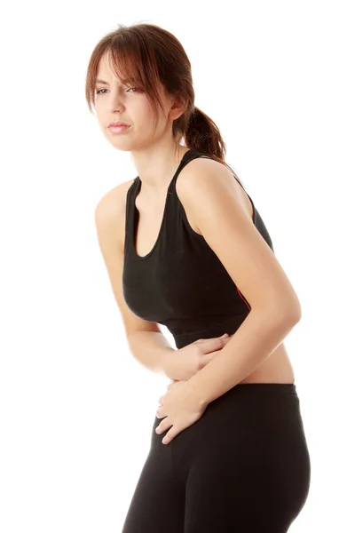 白い背景で隔離の胃の問題を持つ女性 — ストック写真
