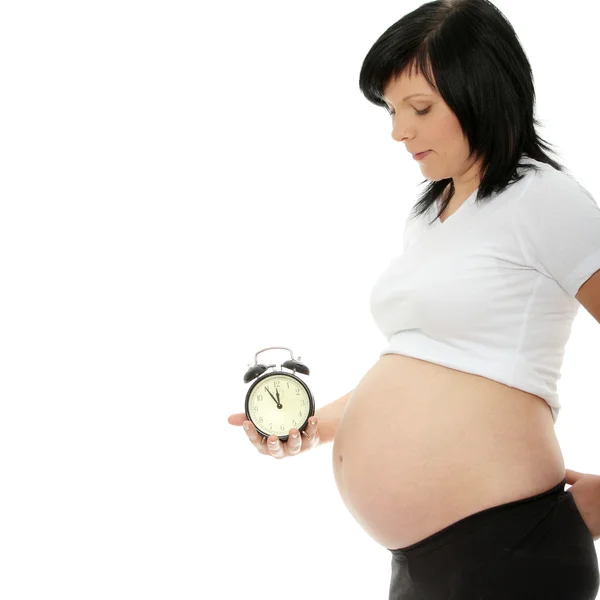 Zwangere Vrouw Met Wekker Geïsoleerd Wit — Stockfoto