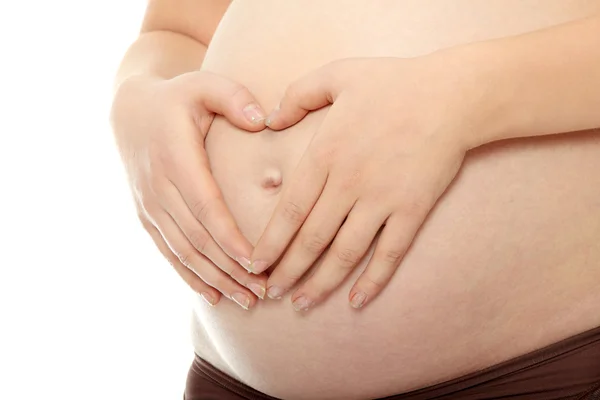 Brzuch Kobiety Ciąży Jej Ręce Nim Białym Tle — Zdjęcie stockowe