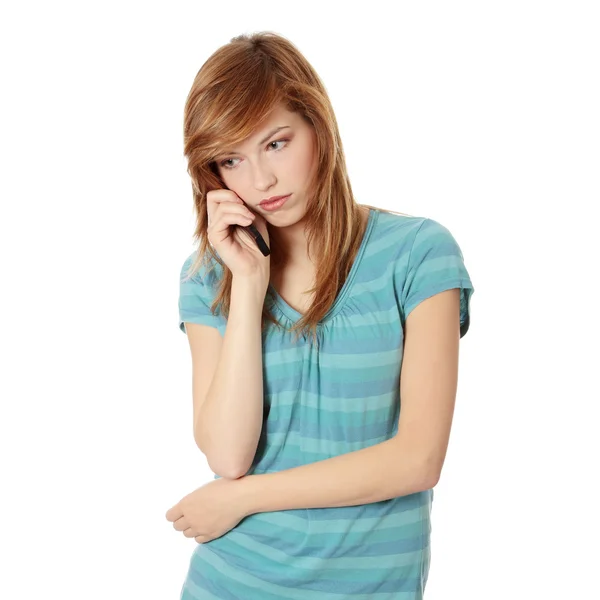 通过电话得到坏消息的年轻女子 在白色隔离 — 图库照片