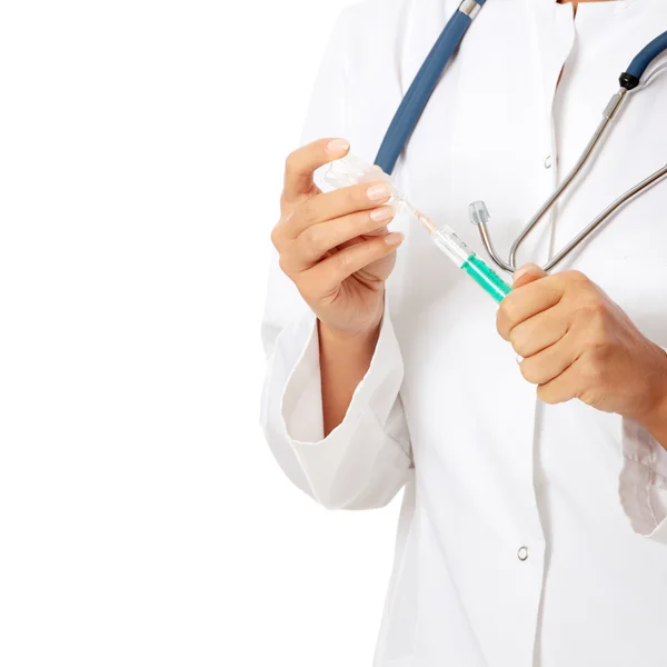 Female doctor or nurse holding syringe — Stock Photo, Image