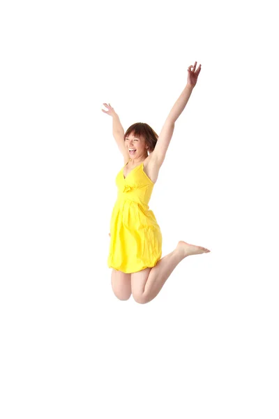 Χαμογελαστά Έφηβος Κοπέλα Στο Κίτρινο Καλοκαίρι Φόρεμα Άλμα Απομονώνονται Λευκό — Φωτογραφία Αρχείου