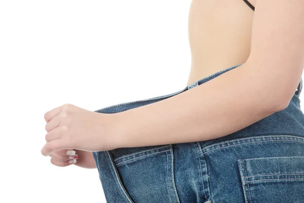 Adolescente mujer mostrando cuánto peso perdió —  Fotos de Stock