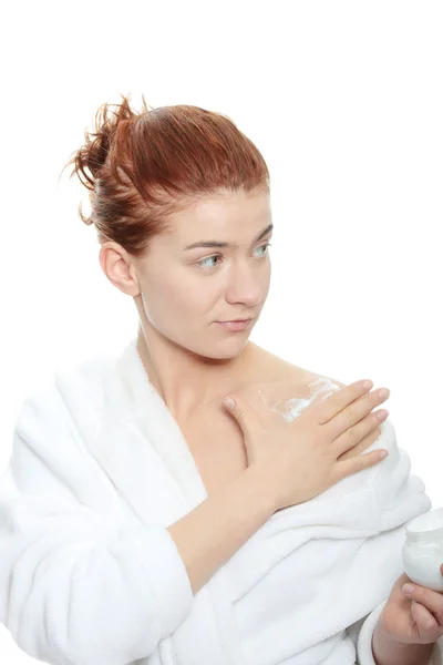 Woman applying moisturizer cream — Stock Photo, Image