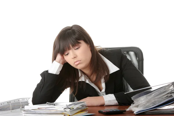 Exhausted Female Filling Out Tax Forms While Sitting Her Desk Royalty Free Stock Images