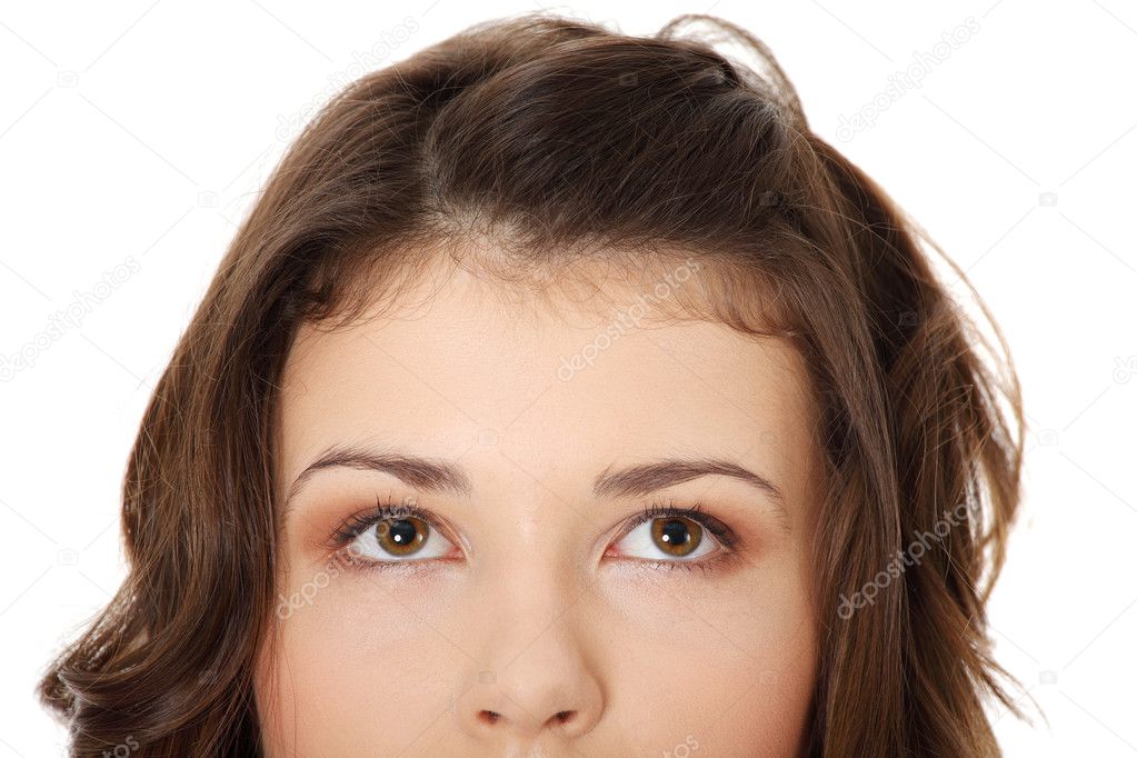 Young teen girl with her eyes looking up