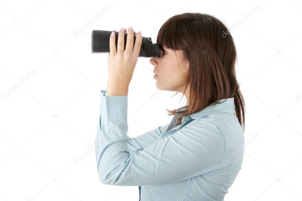 Business woman looking through binocular