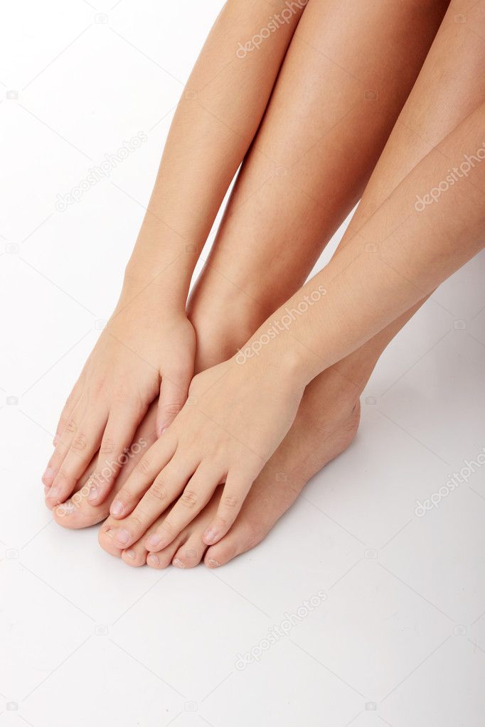 Female legs and hands over white