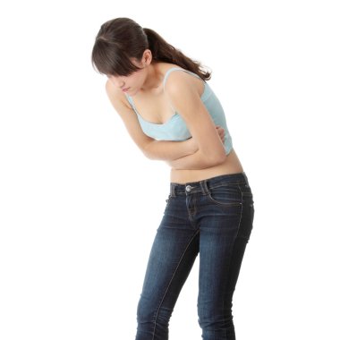 Young teen woman with stomach ache, isolated on white background clipart