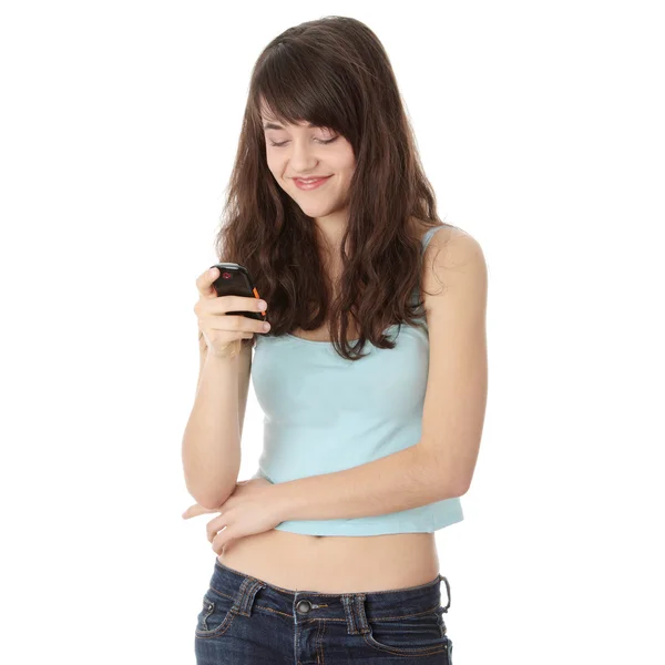 使用手机被隔绝在白色背景上的青少年白种女人 — 图库照片