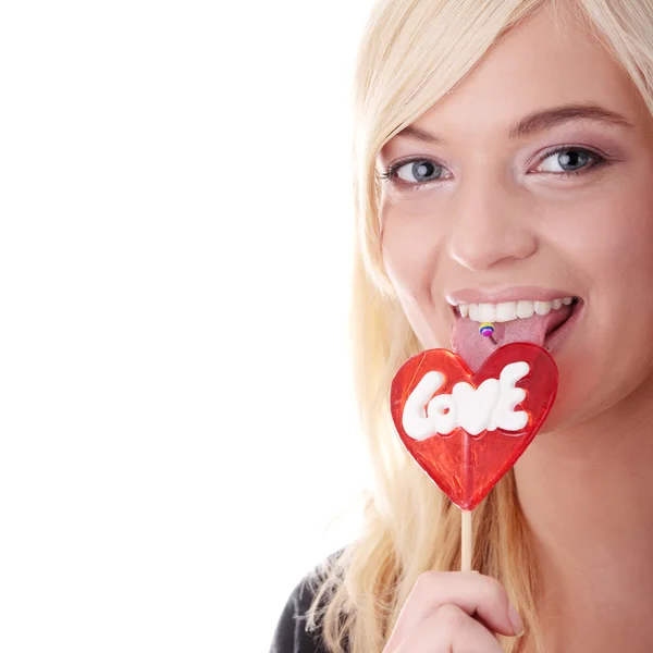 Ragazza adolescente in possesso di lecca-lecca rosso — Foto Stock