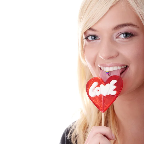 Teenage pige holder rød slikkepind - Stock-foto