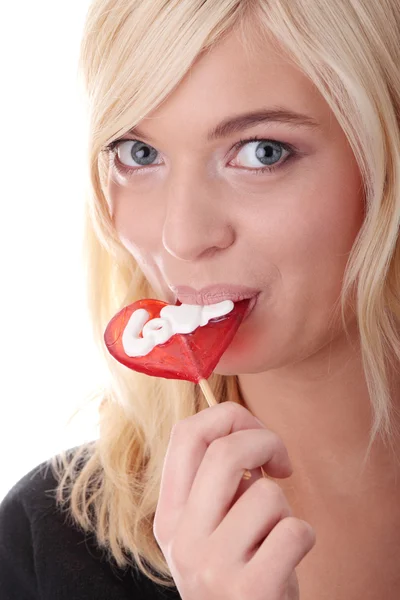 Teenage girl holding red lollipop — Stock Photo, Image