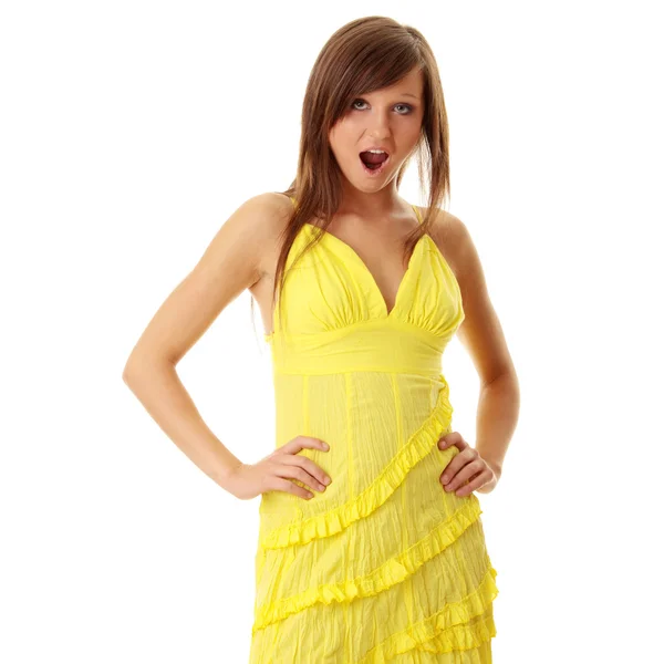 Beautiful brunette girl in yellow dress. — Stock Photo, Image