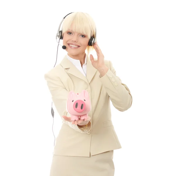 貯金箱を保持しているヘッドセットを持つ女性 — ストック写真