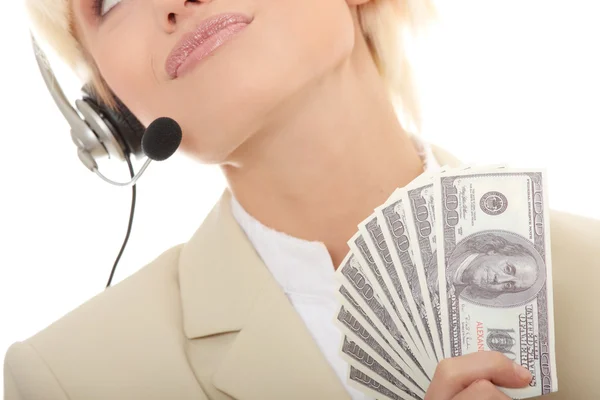 Mujer de negocios con auriculares que sostienen dólares —  Fotos de Stock