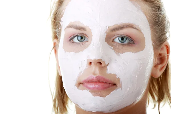 Young female face with clay mask — Stock Photo, Image