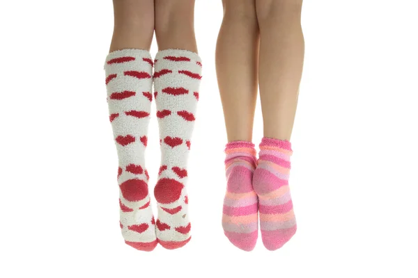 Four legs with colorful socks — Stock Photo, Image