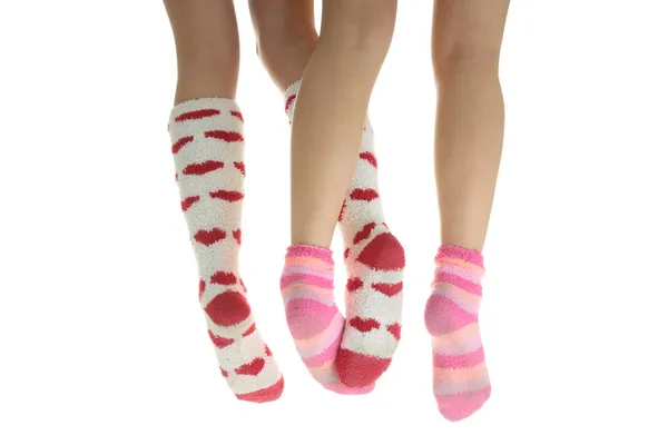 Fyra ben med färgglada strumpor — Stockfoto