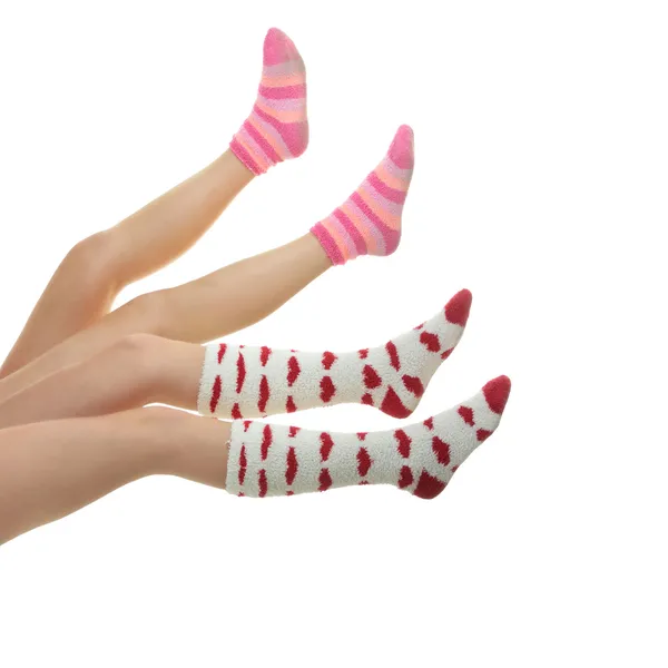 Vier Beine Mit Bunten Socken Isoliert Auf Weiß — Stockfoto