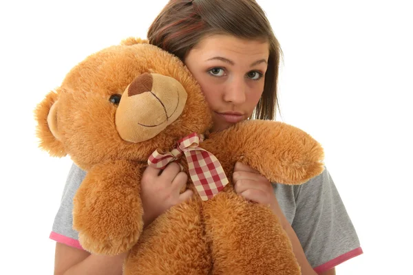 Vacker tonåring håller en nallebjörn — Stockfoto
