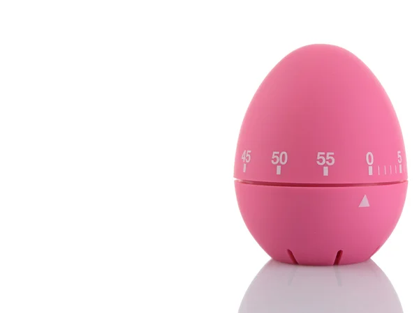 白い背景上に分離されてピンクの卵のタイマー — ストック写真